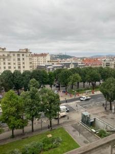 a view of a city with a parking lot at Appartement partagé -Place Jean Mace in Lyon
