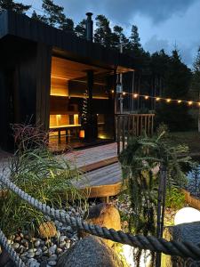 a house on a wooden deck with a rope at My little happy place in Undva