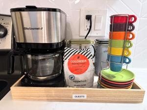 a kitchen counter with a blender and other kitchen utensils at 20 min NYC-Modern Private Room-Queen Bed-Parking in Jersey City