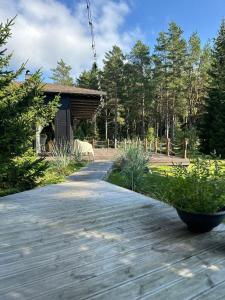 a walkway in front of a house with trees at My little happy place in Undva +23 photos
