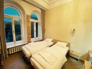 Postel nebo postele na pokoji v ubytování Апарт-готель в центрі міста