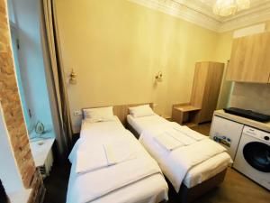 Postel nebo postele na pokoji v ubytování Апарт-готель в центрі міста