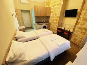 Postel nebo postele na pokoji v ubytování Апарт-готель в центрі міста