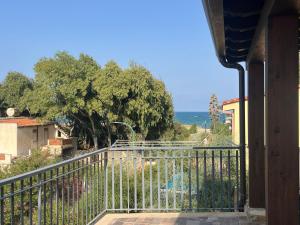 a balcony with a view of the ocean at Etna e mare per il tuo relax in Villaggio San Leonardo
