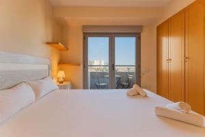 Ліжко або ліжка в номері VLC New Downtown Apartment +9 фото