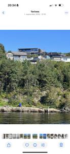 a page of a website with a picture of a river at Villa med 4 soverom, sjøutsikt og hage ved lokal badestrand in Bergen