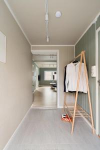 a room with a shelf with a shirt on it at Elegant apartment in city centre in Tromsø
