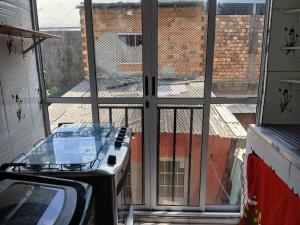 a room with a window with a view of a street at House in Belém, 2 bedrooms - COP 30 in Belém