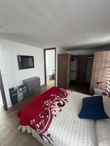Ένα ή περισσότερα κρεβάτια σε δωμάτιο στο Hogar Periférico Sur