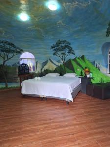 En eller flere senge i et værelse på Hotel y restaurante villa marquez