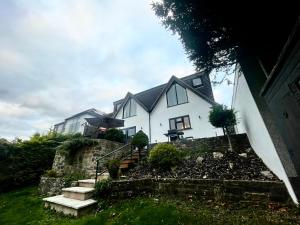 a house on top of a hill with stairs at The Diamond Retreat in Purley