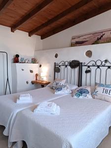 a bedroom with two beds with white sheets at Vivaldi Summer in Icod de los Vinos