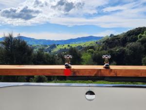 a view of the mountains from the deck of a boat at Glenwood Akaroa Bush Retreat - Kanuka Hut in Akaroa