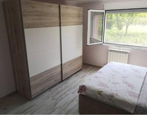 a bedroom with a bed and a large window at Javahome in Ocho Rios