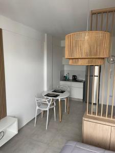 a kitchen with a table and chairs in a room at Nordico II in La Plata