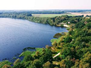 an aerial view of a river with trees at 6 person holiday home in Ansager in Ansager