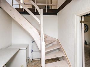a staircase in a room with white walls at 4 star holiday home in Asaa in Aså