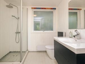 a bathroom with a shower and a sink and a toilet at 5 person holiday home in Hals-By Traum in Hals +42 photos