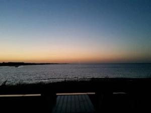 a view of the ocean at sunset at 8 person holiday home in Hadsund in Hadsund +35 photos