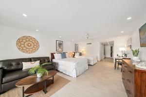 a large living room with a bed and a couch at Maui Kaanapali Villas 119 · MKV 119 Newly Remodeled Garden View in Kahana +49 photos