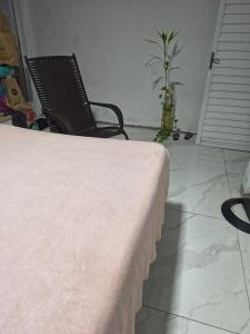 a table with a pink blanket on top of it at house cop30 in Ananindeua