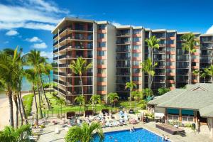 an image of a resort with a pool and palm trees at AEI at Kaanapali Shores in Lahaina
