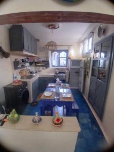 an aerial view of a kitchen with a table at Dar Mobarak in Oualidia