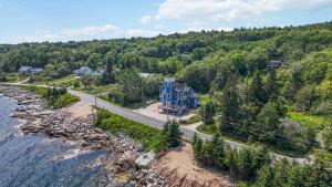 an aerial view of a house next to the water at Vista Del Mar 596 in Hubbards
