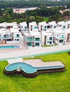 an aerial view of a resort with a swimming pool at Casa por temporada in Barreirinhas