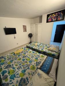 Postel nebo postele na pokoji v ubytování Casa Osiris