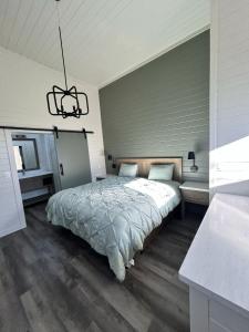 a bedroom with a bed and a chandelier at Luxurious Tiny Home 15 Minutes from Sedona! #25 in Cottonwood