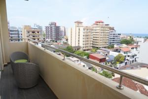 a balcony with a view of a city at Modern 3 BR Apt in Dehiwala