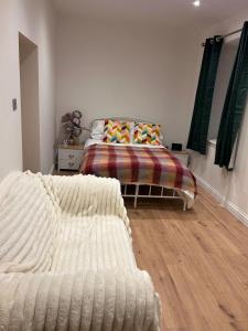 a bedroom with two beds in a room with a bed at Kielder Station Master's House in Kielder