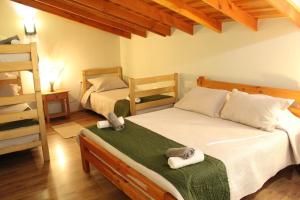 Postel nebo postele na pokoji v ubytování Nido Del Bosque