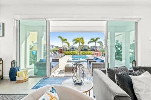 an open living room with a view of a pool at LC517T The Chic Abode at Liberty Bluff in Kissimmee