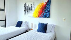 Un pat sau paturi într-o cameră la Apartamento Luxury ubicado en la mejor zona comercial de la ciudad