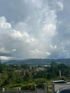 a view of a city under a cloudy sky at Elegant Escape in Montego Bay