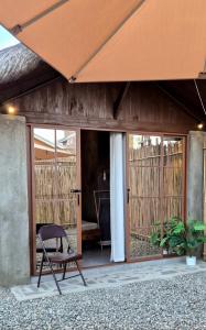 a chair sitting in front of a house at Casa Elia San Juan La Union in San Juan
