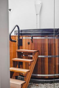 a group of wooden stairs in a room at The Prescription Pad - Group Getaway for Families in Port Sorell +9 photos