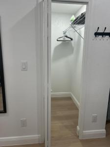 an open door to a room with a closet at Geo Property- Beautiful and Private Apartment in Tampa