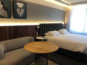 Ένα ή περισσότερα κρεβάτια σε δωμάτιο στο The Rockefeller Hotel Cape Town +17 φωτογραφίες