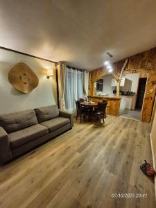 a living room with a couch and a table at Casa Mirada Azul in Isla Negra