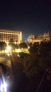 a city street at night with a large building at Host-Gram Hotel & Suites Downtown in Cairo