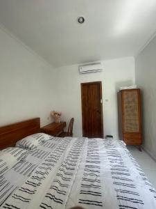 Postel nebo postele na pokoji v ubytování Casa Feliz Guest House