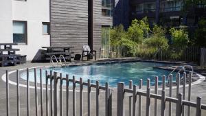 a small swimming pool with a fence around it at Apartamento Pucón in Pucón