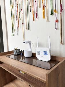a counter with a sewing machine and other items on it at INTI Entire apartment and private terrace in Quito +60 photos