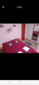 a room with a bed with two laptops on it at La fortaleza A una cuadra de la terminal in Concordia