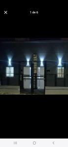 a picture of a building at night with lights at La fortaleza A una cuadra de la terminal in Concordia