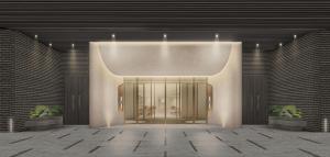 a lobby with a door and two potted plants at The Reserve Hotel Luoyang, Curio Collection By Hilton in Luoyang