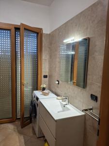 a bathroom with a sink and a mirror at ARISTOCASA in Lecce +59 photos